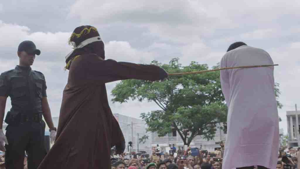 Gay man caned in Indonesia as crowd chants “hit him harder”