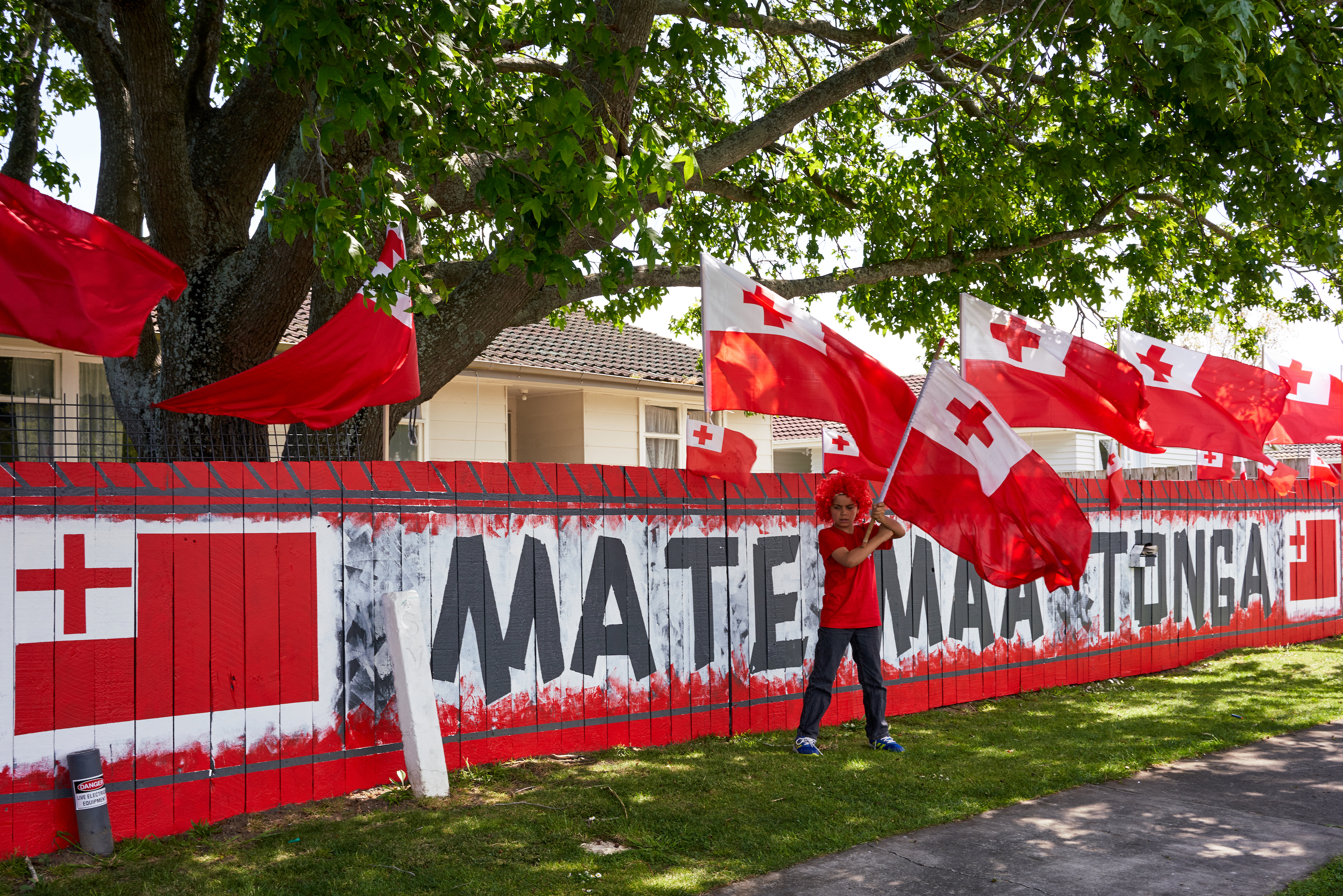 Mate ma'a Tonga on suburban fence
