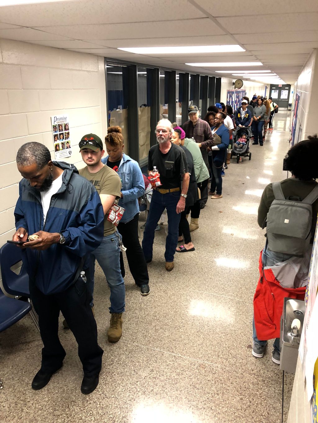Georgia voters in key districts  showed up to malfunctioning machines and hours-long waits