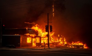 A store burns as the Camp Fire tears through Paradise, California on November 8.