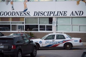 Toronto police respond to a bomb threat at St. Michael's College School, in Toronto on Monday, Nov. 19, 2018. Six teens have been arrested and charged in connection with an alleged sexual assault at an all-boys private school in Toronto, police said Monda
