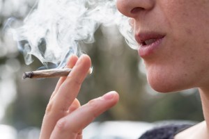 Young person smoking marijuana