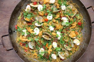 fideos topped with clams, uni, aioli, and herbs