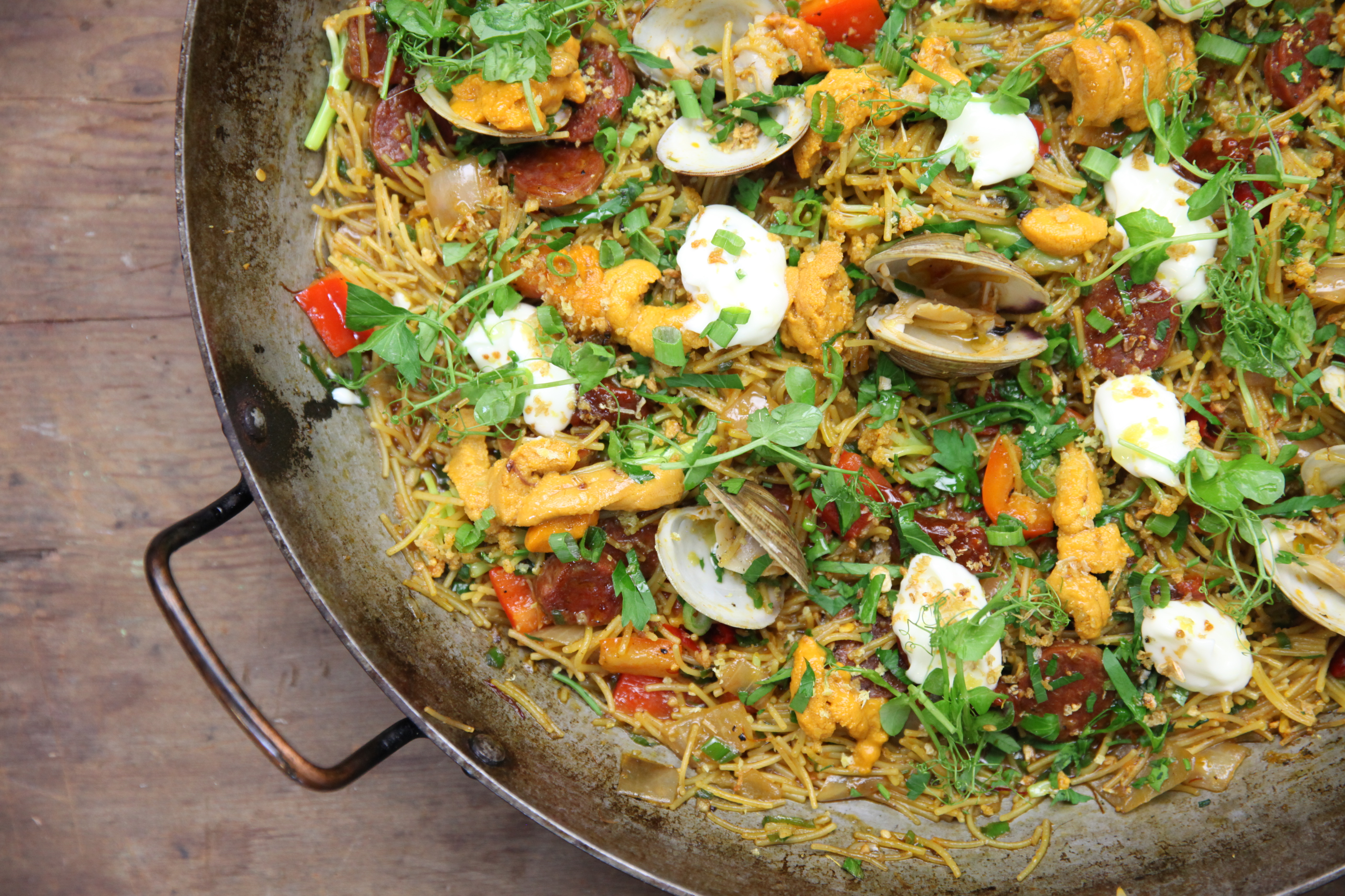 fideos topped with clams, uni, and aioli