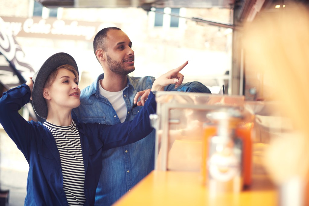 people ordering takeout from cafe