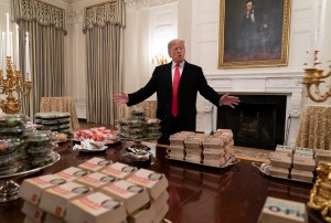 Donald Trump surveys feast of fast food in White House.