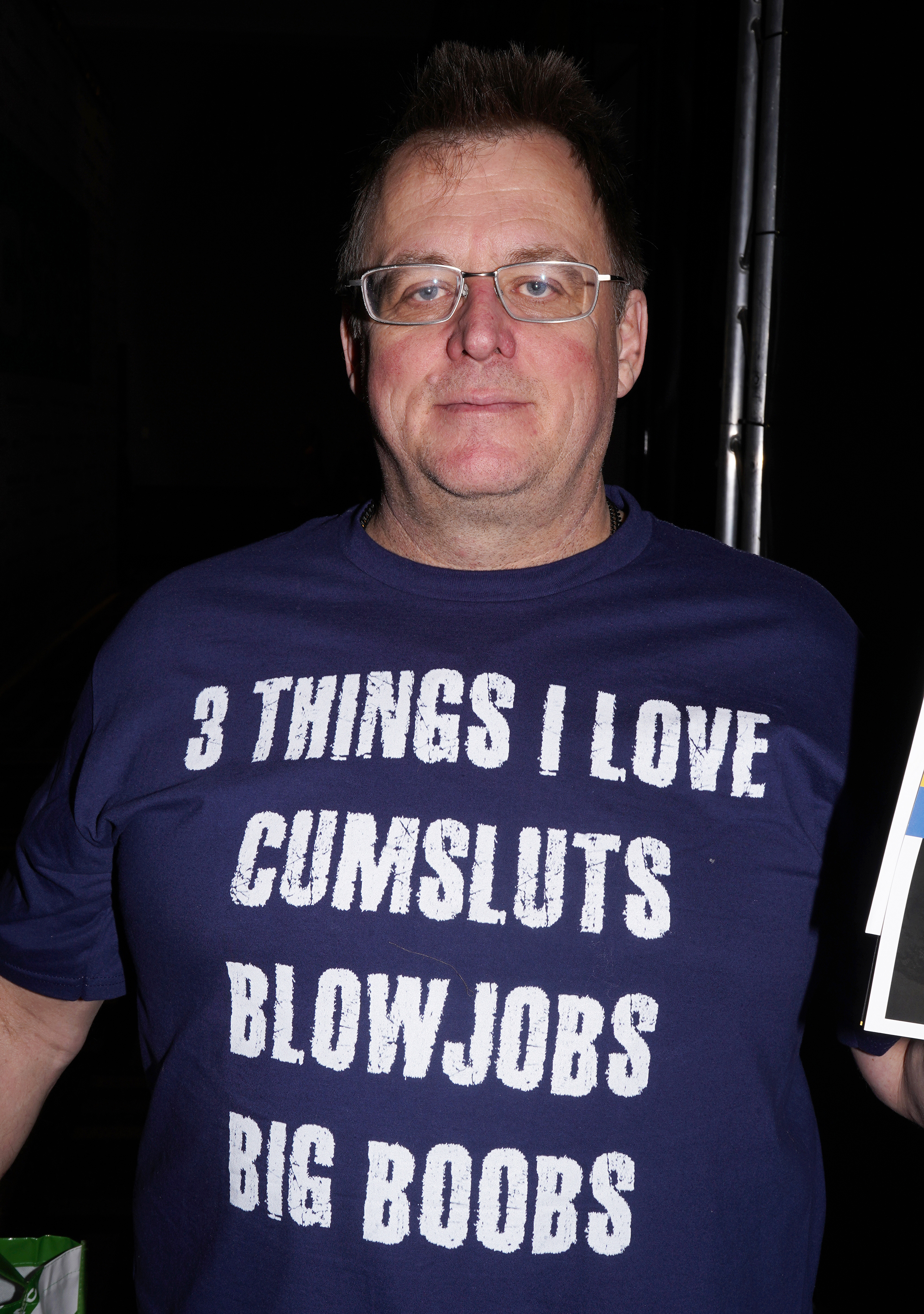 A man in a shirt that reads