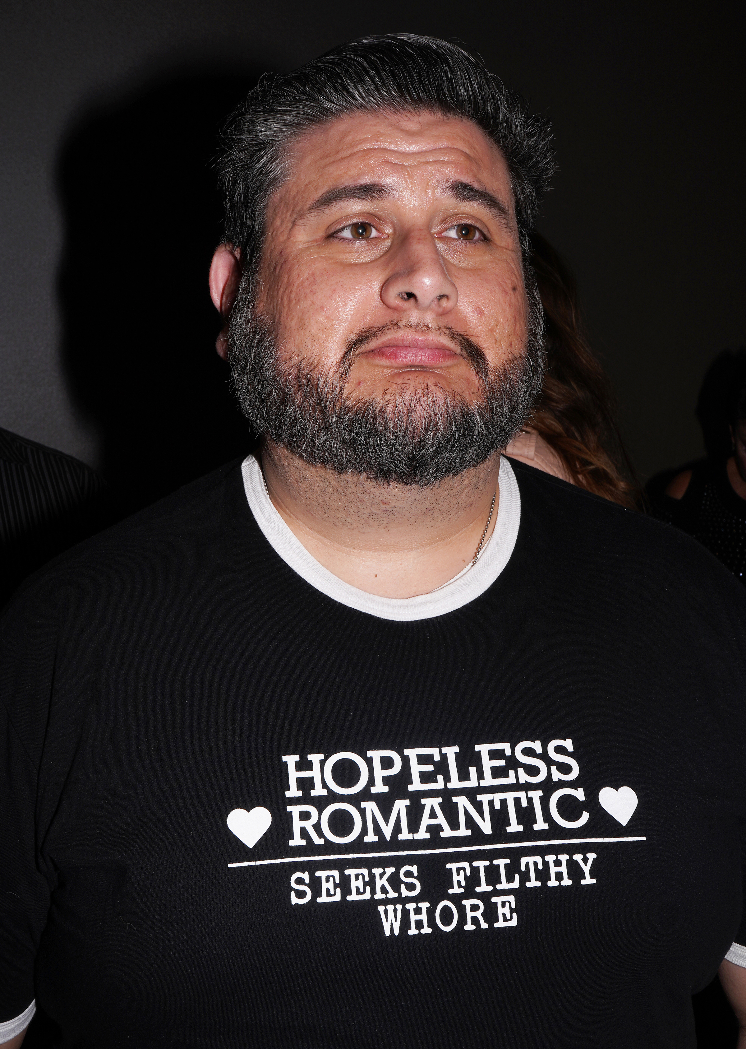 A man in a shirt that reads