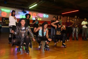 A group of women skating at a roller rink