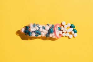 Pink condom full of pills