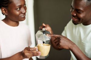 A man pours a woman coffee
