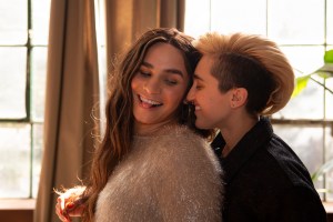 A transfeminine non-binary person and transmasculine gender-nonconforming person flirting