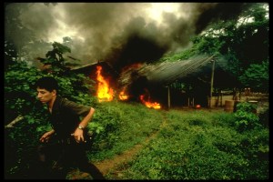 Colombian anti-narcotics police 7th Co., burning down a cocaine lab in the early 90s.