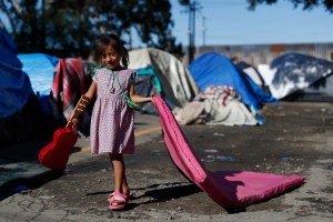 The Trump administration implemented a new rule Tuesday that will effectively end asylum protections for the hundreds of thousands of migrants who pass through another country on their way to the U.S.