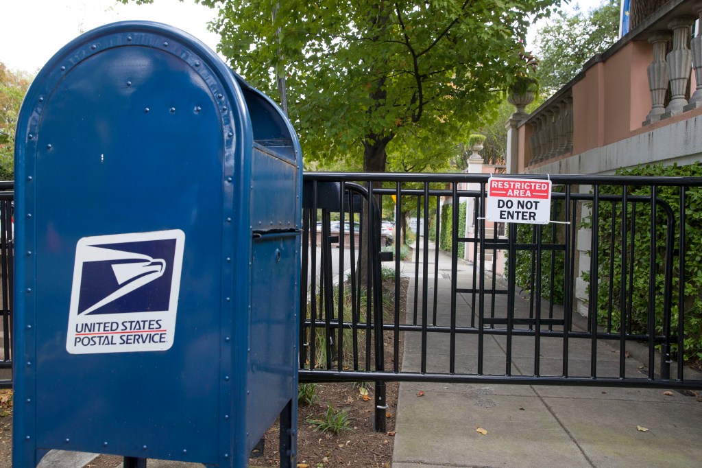 A U.S. Postal Service mail box is seen at a checkpoint near the home of President Barack Obama