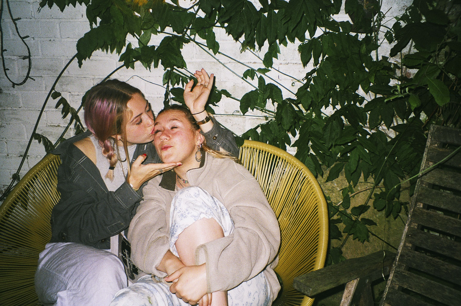 girl kissing girl on forehead