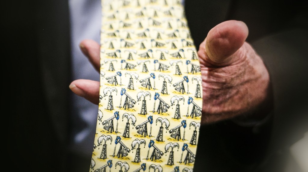 A tie covered in drawings of oil wells.