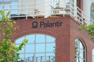 he logo of the data analysis company Palantir can be seen at the company's headquarters.