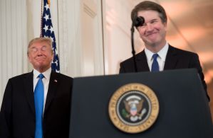 Donald Trump stands next to Brett Kavanaugh.