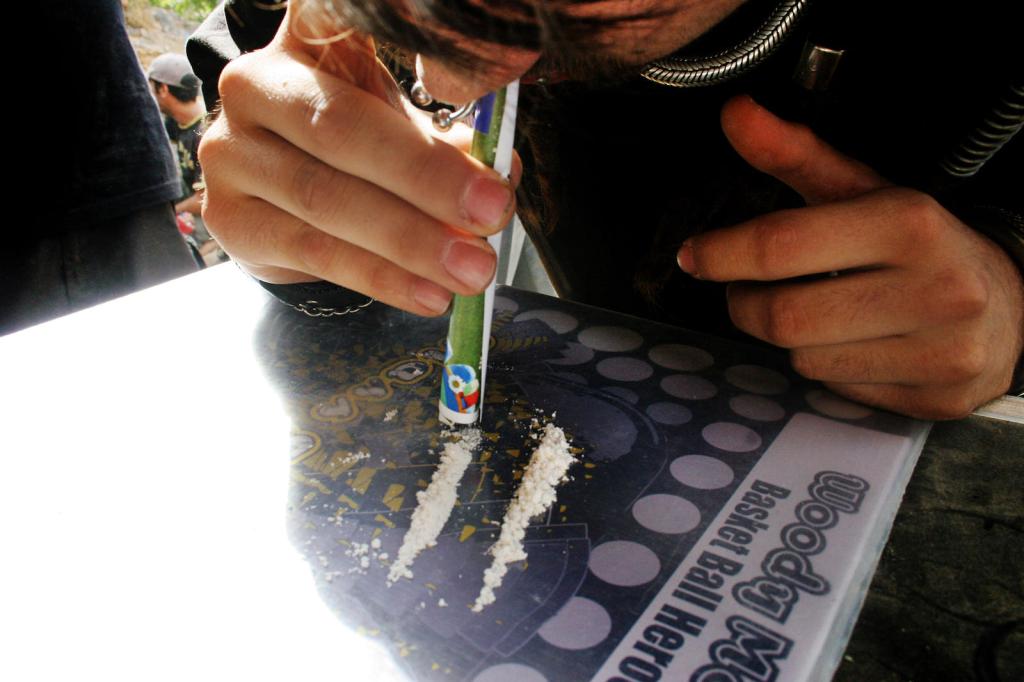 guy sniffing drugs