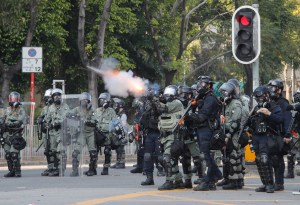 Police fire tear gas at anti-government protesters at Shatin, Hong Kong, Tuesday, Oct. 1, 2019. Thousands of black-clad pro-democracy protesters defied a police ban and marched in central Hong Kong on Tuesday,