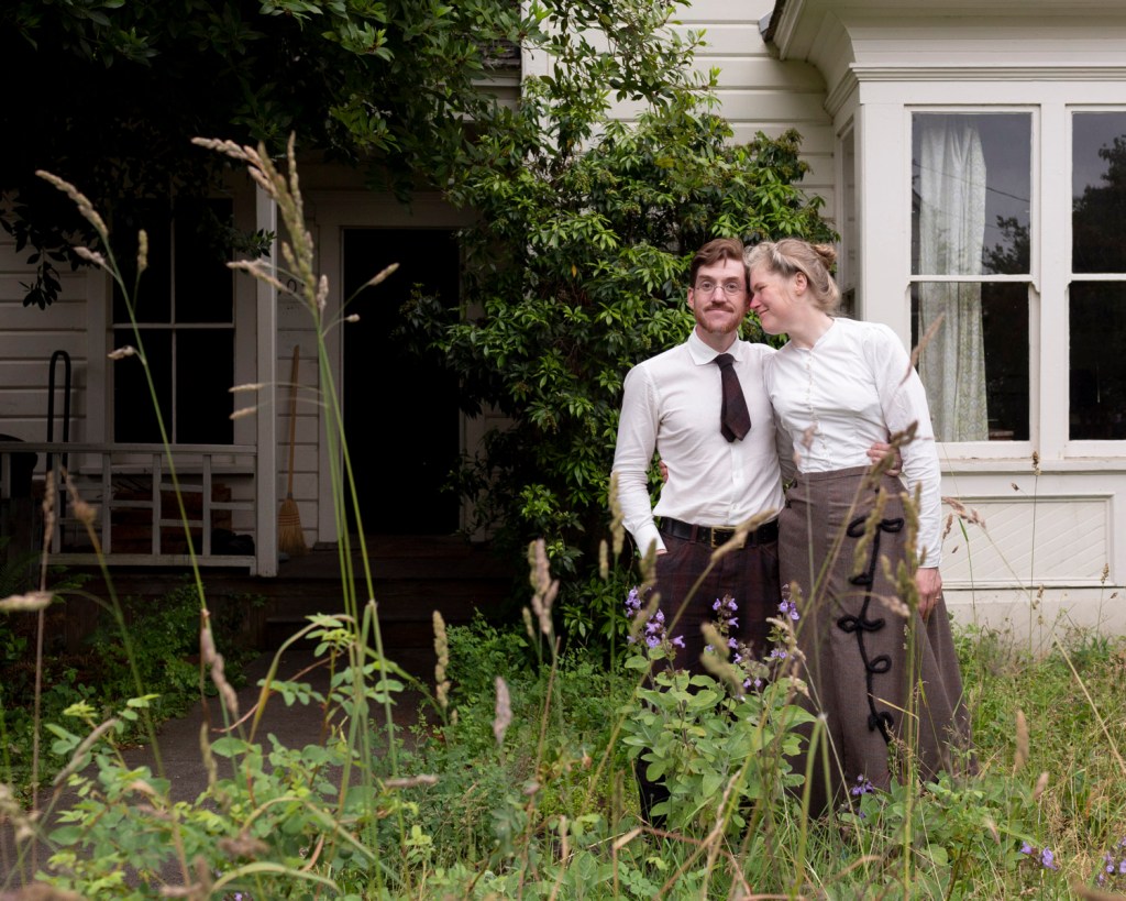 Gabriel and Sarah Chrisman in front of their house