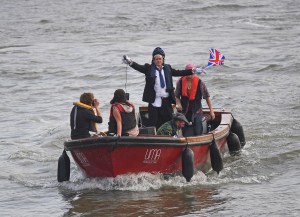 Extinction Rebellion protesters travel up the River Thames in a boat in central London. Picture date: Tuesday October 15, 2019.