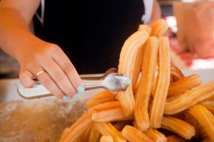 street vendor woman with churros