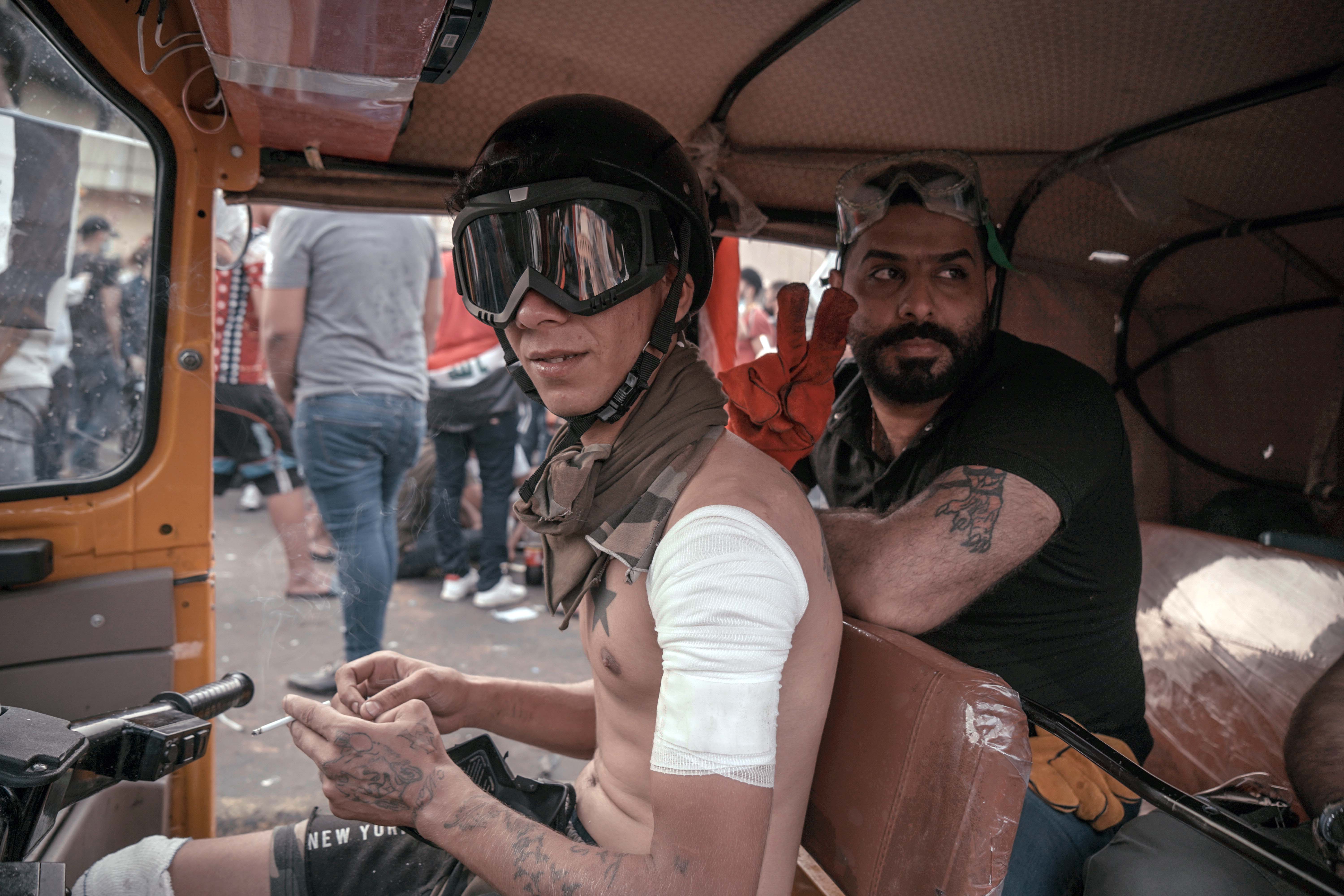 A tuk-tuk driver during the demonstrations in Baghdad, Iraq