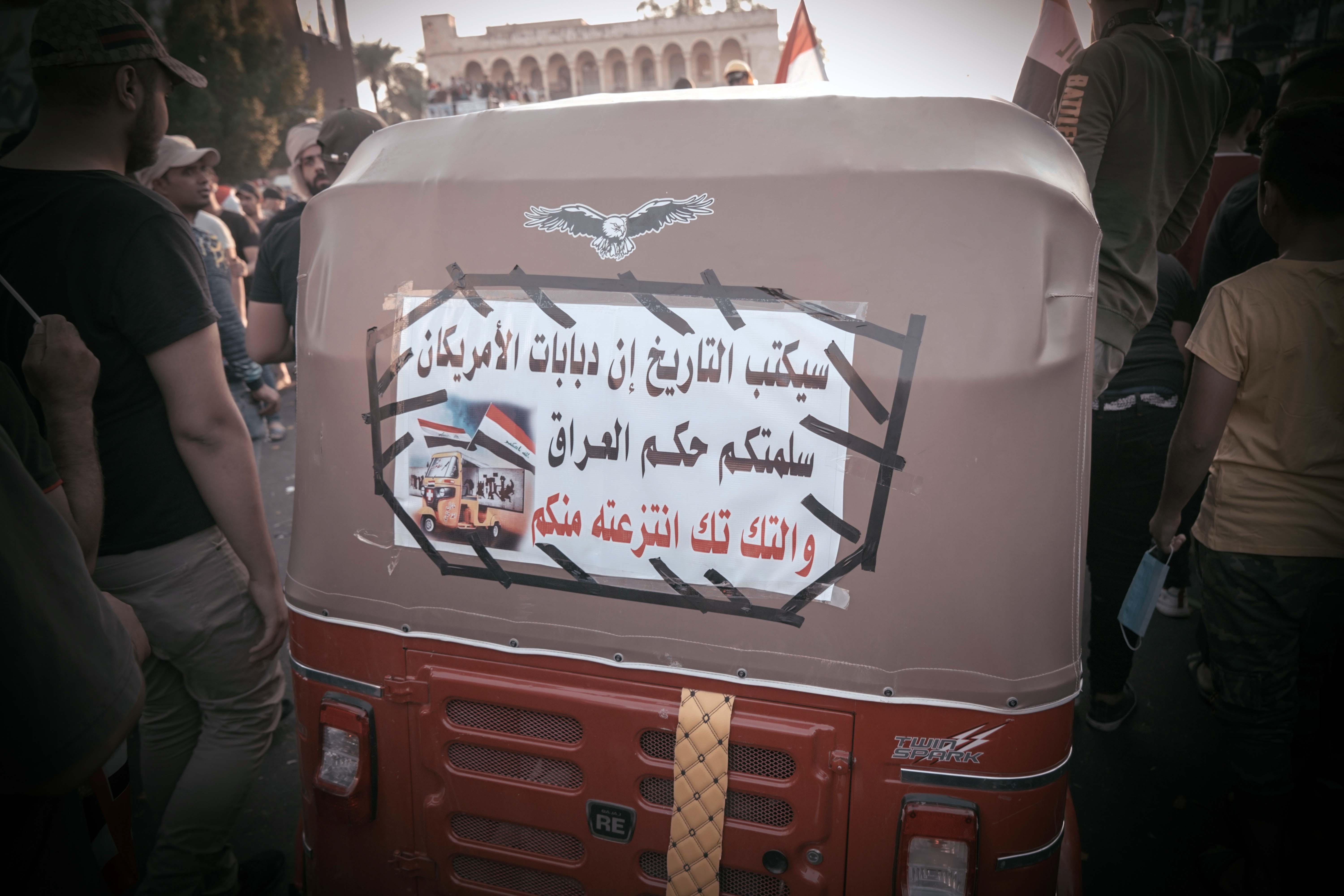 The back of a tuk-tuk on the street during the demonstrations in Baghdad, Iraq