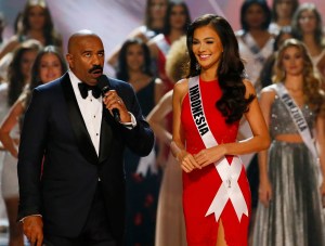 Kezia Warouw of Indonesia prepares to answer a question from host Steve Harvey after making it to the top 13 in the Miss Universe 2016 competition Monday, Jan. 30, 2017, at the Mall of Asia in suburban Pasay city, south of Manila, Philippines. (AP Photo/B