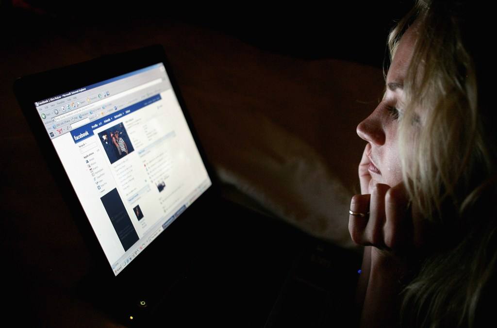 Woman looking at Facebook.