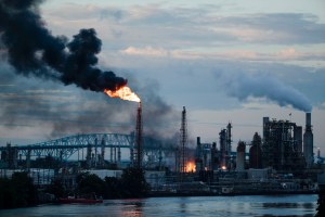 In this June 21, 2019 file photo, flames and smoke emerge from the Philadelphia Energy Solutions Refining Complex in Philadelphia. (AP Photo/Matt Rourke, File)​