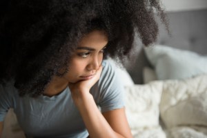 woman looking concerned / What to Do if You're Freaking Out About Your 401(k) Right Now