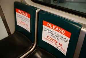 Empty seats with sign