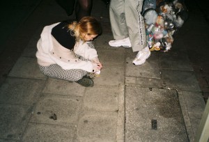 Despondent woman sitting on ground