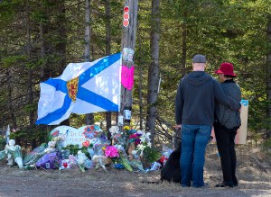 A former neighbour of the man who killed 22 people in a rampage last month in Nova Scotia said she warned the RCMP about him years ago.