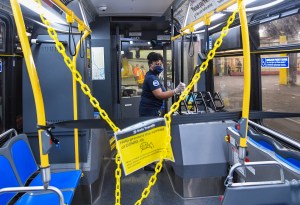 Woman cleaning bus