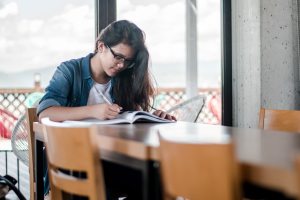 student reading book
