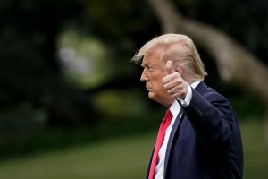 U.S. President Donald Trump gives a thumbs up as he walks toward Marine One on the South Lawn of the White House on July 24, 2020 in Washington, DC.