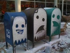 Three USPS mailboxes.