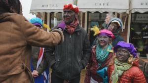An entire family dressed in blackface.