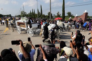 George Floyd's funeral procession arrives at Houston Memorial Gardens cemetery, Tuesday, June 9, 2020, in Pearland, Texas. (AP Photo/Eric Gay)