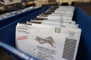 Mail-in ballots sit in trays before being sorted at the Santa Clara County registrar of voters office on October 13, 2020 in San Jose, California.