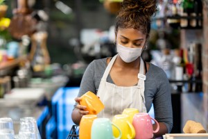 Restaurant worker wearing a face mask.