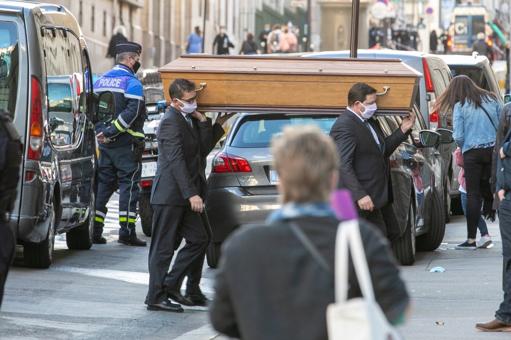 Pallbearers carry Samuel Paty's coffin during the National Tribute to the murdered school teacher Samuel Paty on October 21, 2020 in Paris​.