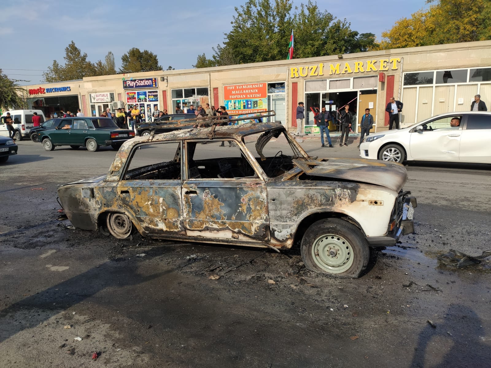 A burned out car in Barda after the attack