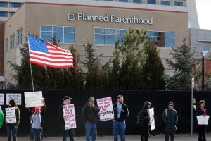 Pro-choice counter-protesters hold signs supporting a woman's right to choose abortion, Denver, Feb. 11, 2017.