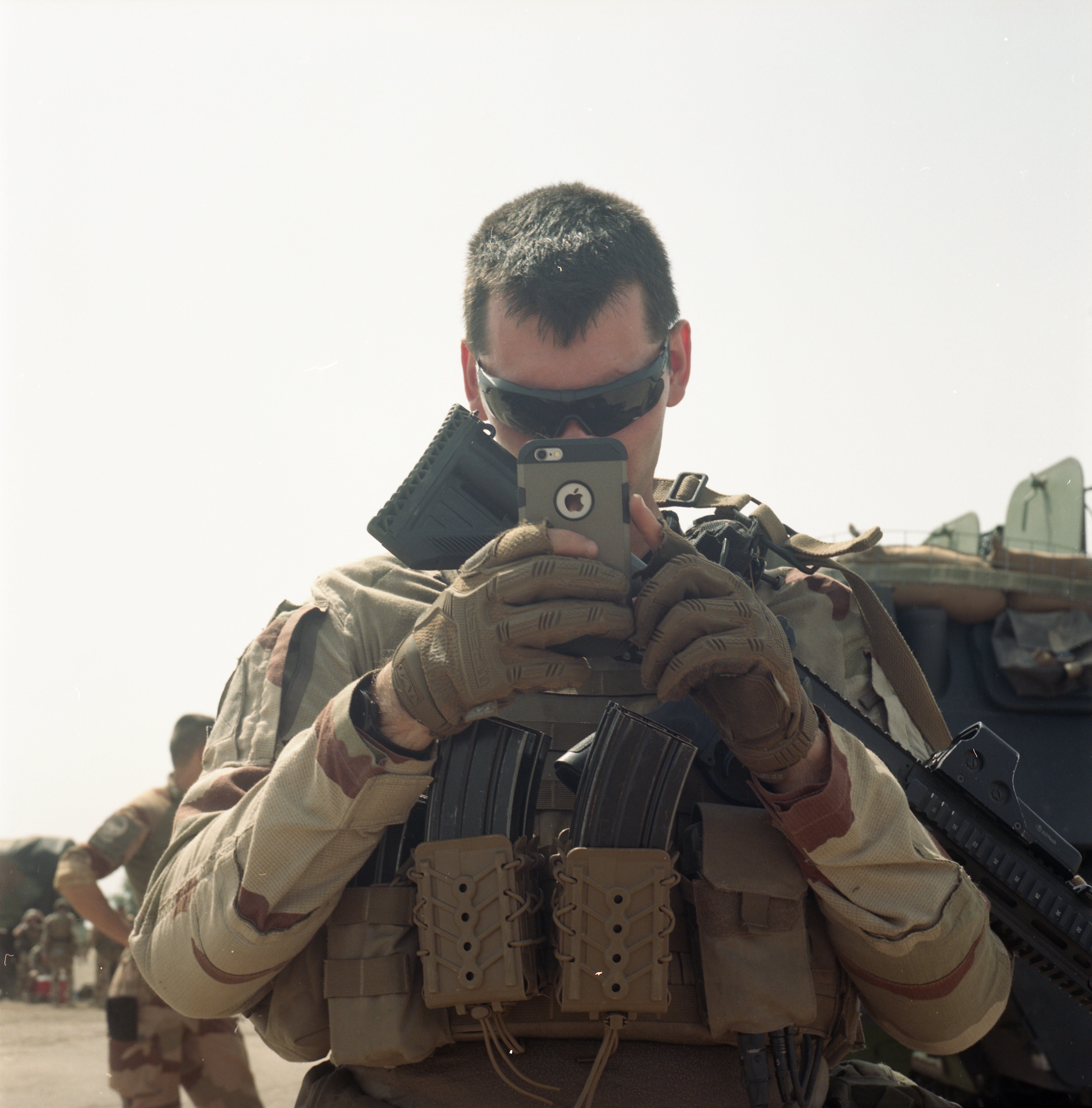 A sergeant taking pictures.