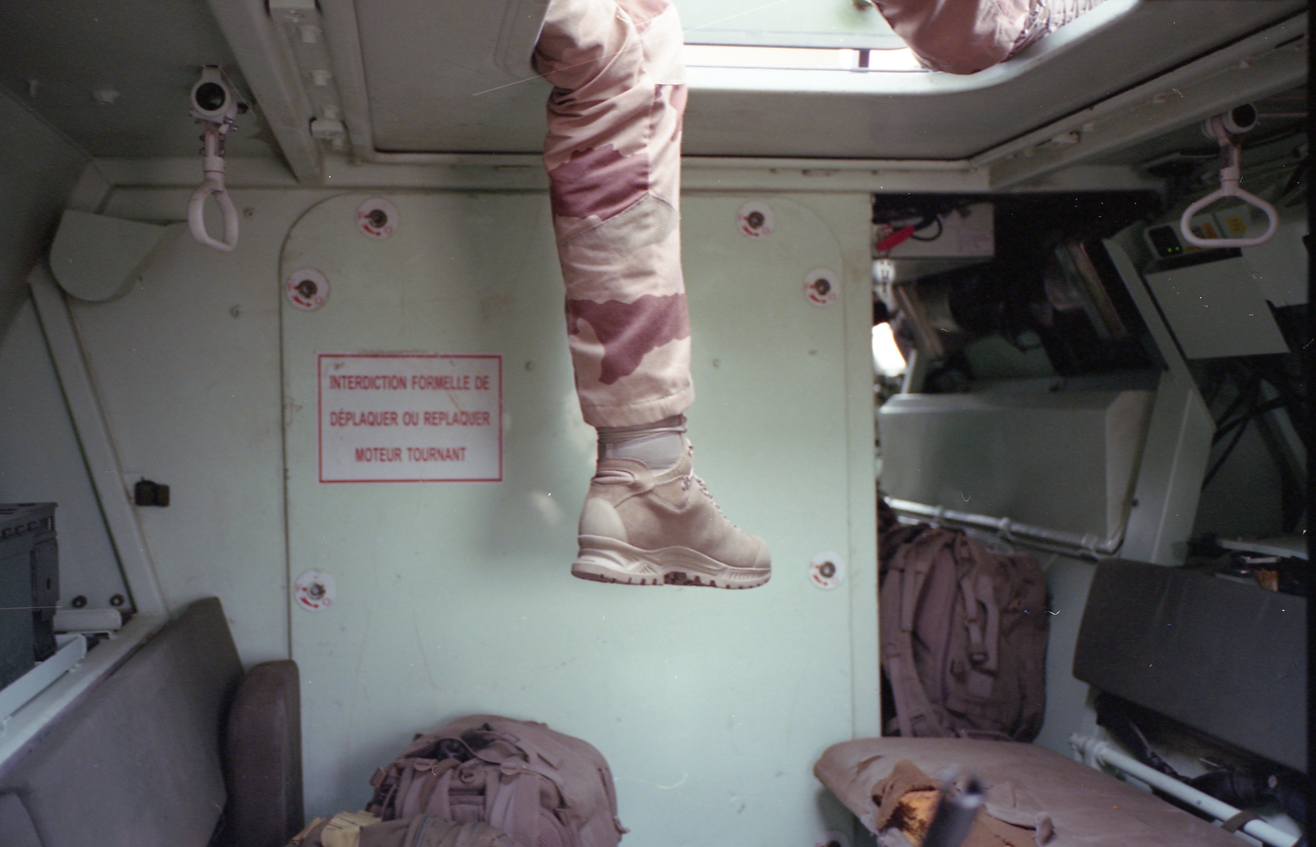 Soldier getting out of a tank.
